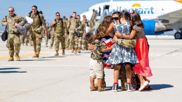 Military families reunite with deployed parents at the airport, showcasing love and support during homecoming.