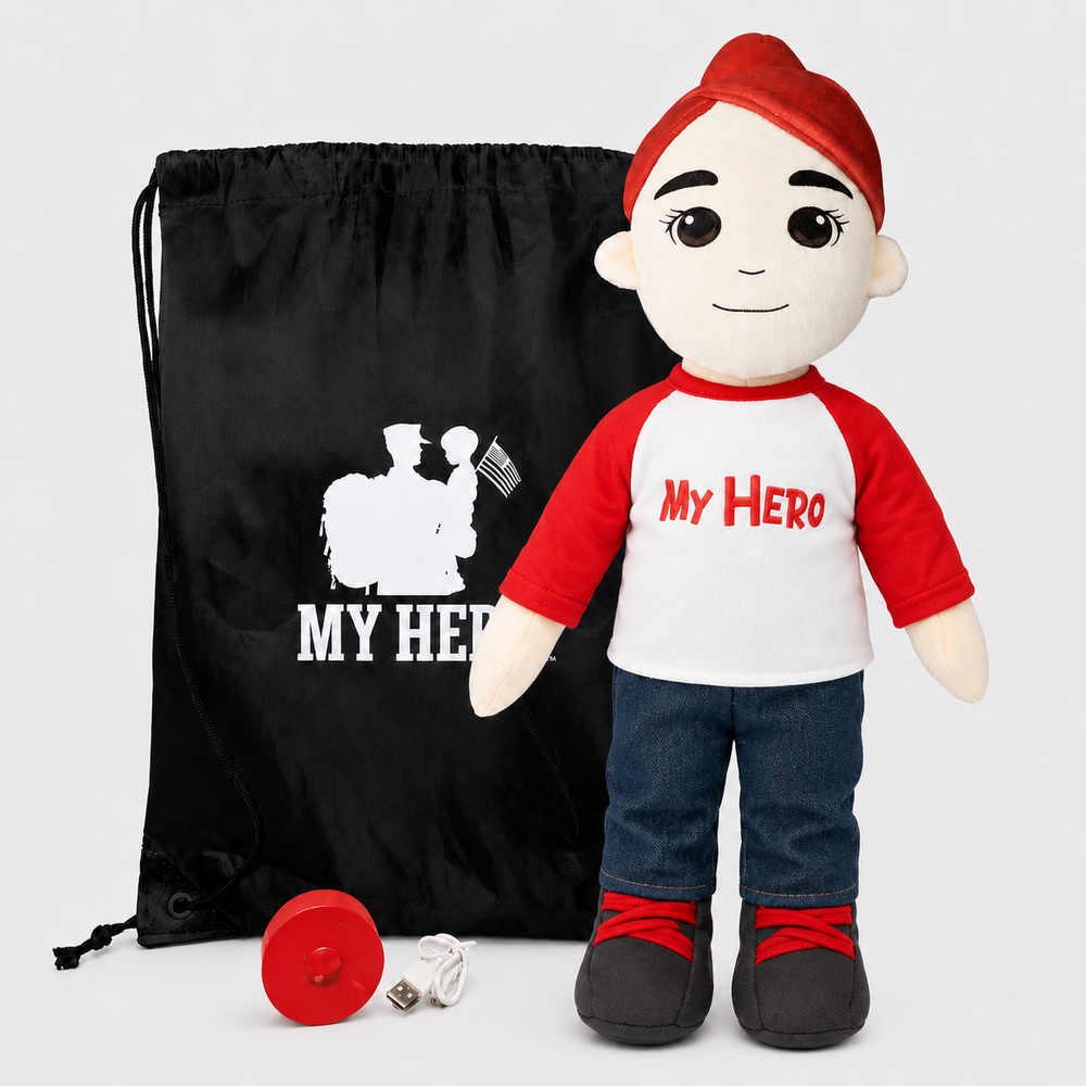 A plush doll toy with a red beanie, red and white raglan shirt reading 'MY HERO', blue jeans, and black-and-red shoes, shown standing beside a black drawstring bag with a white 'MY HERO' graphic and a small red accessory on a light gray background.