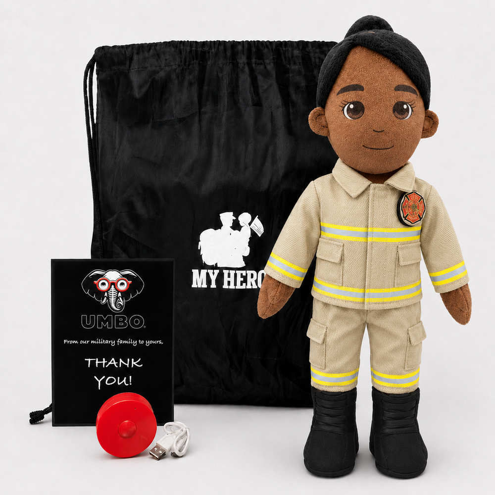 A firefighter-themed plush doll stands in front of a black drawstring bag and a black thank-you card. The doll is wearing a tan uniform with yellow reflective stripes and black boots.