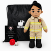 A custom plush toy firefighter doll standing next to a black drawstring bag, a black thank you card, and a small red fire hydrant accessory on a white background.