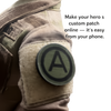 Army Airborne patch mounted on a soldier's sleeve, featuring a black circular design with a bold black letter 'A' on an olive drab background. The image includes a text overlay on the right reading 'Make your hero s custom patch online — it's easy from your phone.