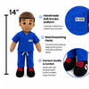 A plush doll wearing a blue scrubs uniform with a small 'MY HERO' patch, shown on a white background with product callouts, a height marker labeled 14 inches, a close-up of the scrubs pocket, and a close-up of the feet.