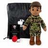 Marine Doll Tan Skin Brown Hair Male Doll standing next to a black drawstring My Hero Backpack with white My Hero Logo and a small red Recorder on a white background.