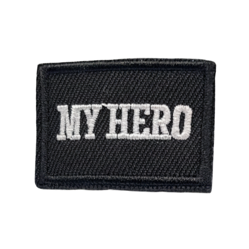 My Hero logo replacement patch in black with white font, hook backing accessory for compatible My Hero Doll uniforms and doll clothing.