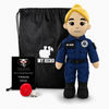 Paramedic Plush with fair skin and blonde hair, female EMT doll in a blue emergency responder uniform with black boots beside a black My Hero backpack, recorder and accessories on a white background.