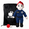 Paramedic Doll with fair skin and red hair, female emergency responder doll in a blue EMT uniform with black boots beside a black My Hero backpack, recorder and accessories on a white background.