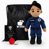 Emergency Responder Doll with tan skin and black hair, female paramedic plush in a blue EMT uniform with black boots beside a black My Hero backpack, recorder, charger and accessories on a white background.