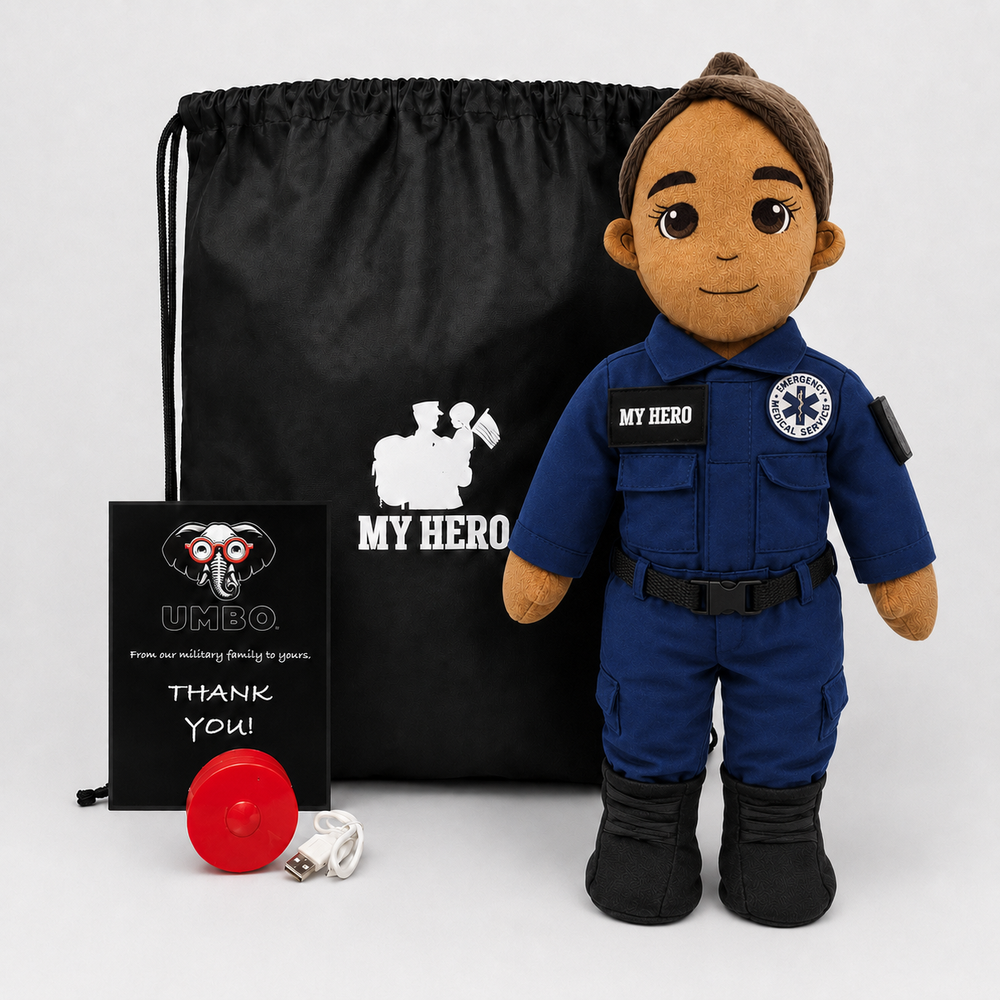 Paramedic Doll with tan skin and brown hair, female emergency responder in a blue EMT uniform with black boots beside a black My Hero drawstring bag, recorder and accessories on a white background.