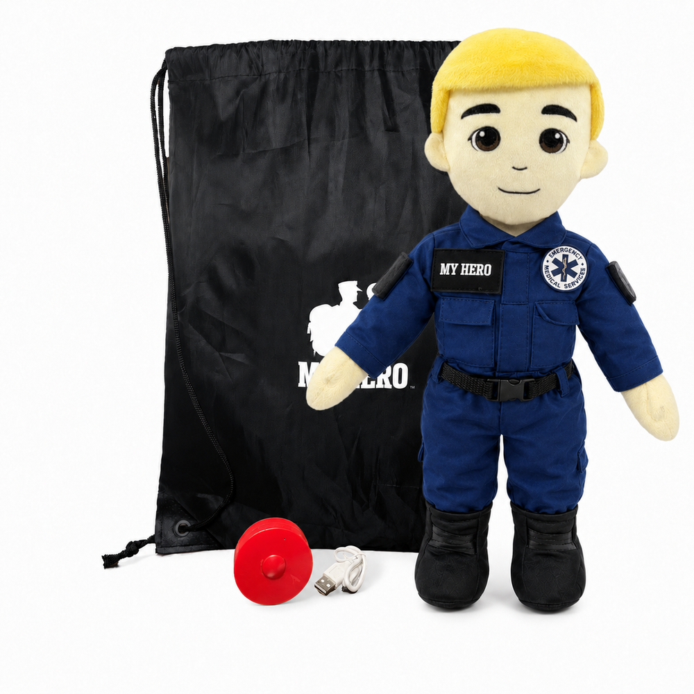 EMT Plush with fair skin and blonde hair, male paramedic doll wearing a blue EMT uniform with black boots beside a black My Hero drawstring backpack, recorder, charger and accessories on a white background.