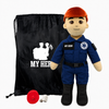 EMT Doll with fair skin and red hair, male paramedic doll wearing a blue emergency responder uniform with black boots beside a black My Hero drawstring bag, recorder and accessories on a white background.