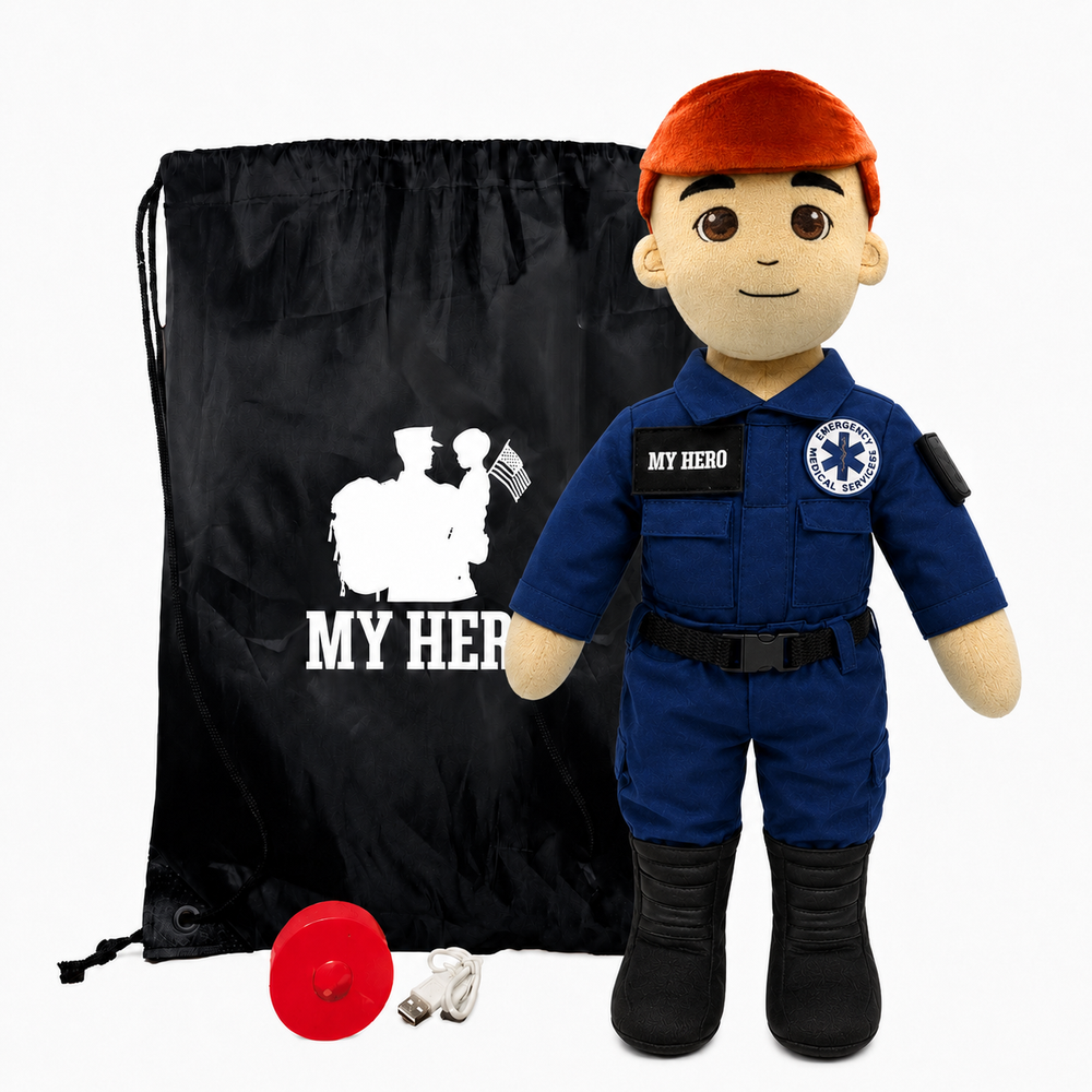 EMT Doll with fair skin and red hair, male paramedic doll wearing a blue emergency responder uniform with black boots beside a black My Hero drawstring bag, recorder and accessories on a white background.
