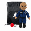 EMT Plush with tan skin and a bald head, male paramedic doll in a blue EMT uniform with black boots beside a black My Hero backpack, recorder, charger and accessories on a white background.