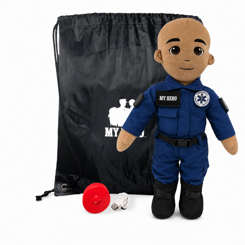 EMT Plush with tan skin and a bald head, male paramedic doll in a blue EMT uniform with black boots beside a black My Hero backpack, recorder, charger and accessories on a white background.