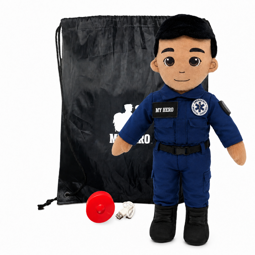 Paramedic Plush with tan skin and black hair, male EMT doll wearing a blue emergency responder uniform with black boots beside a black My Hero drawstring backpack, recorder and accessories on a white background.