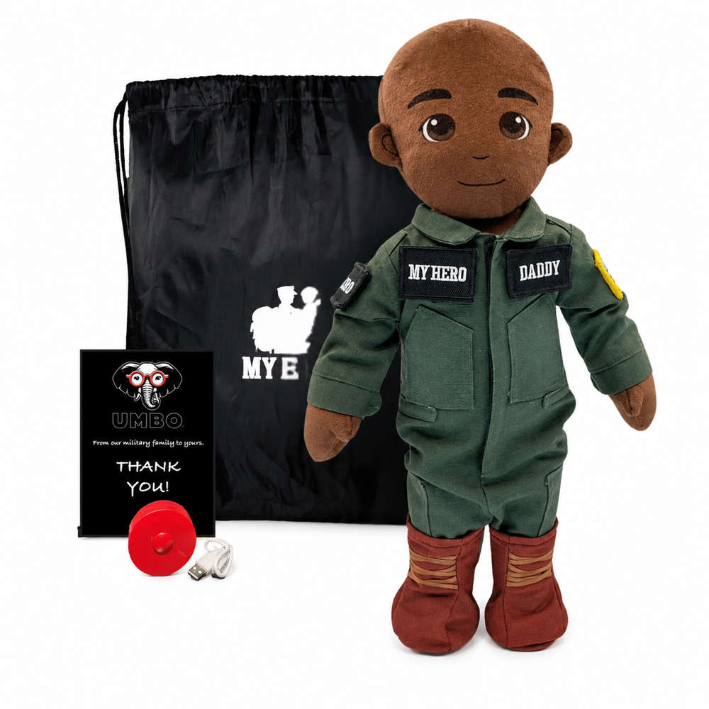 Pilot Daddy Doll Dark Skin Black Hair Male Doll with Flight Suit, My Hero Backpack, Recorder and Charger, A plush doll dressed in a military-style jumpsuit with 'MY HERO' and 'DADDY' patches, shown with a black drawstring bag, a small red disc, and a black thank-you card on a white background.
