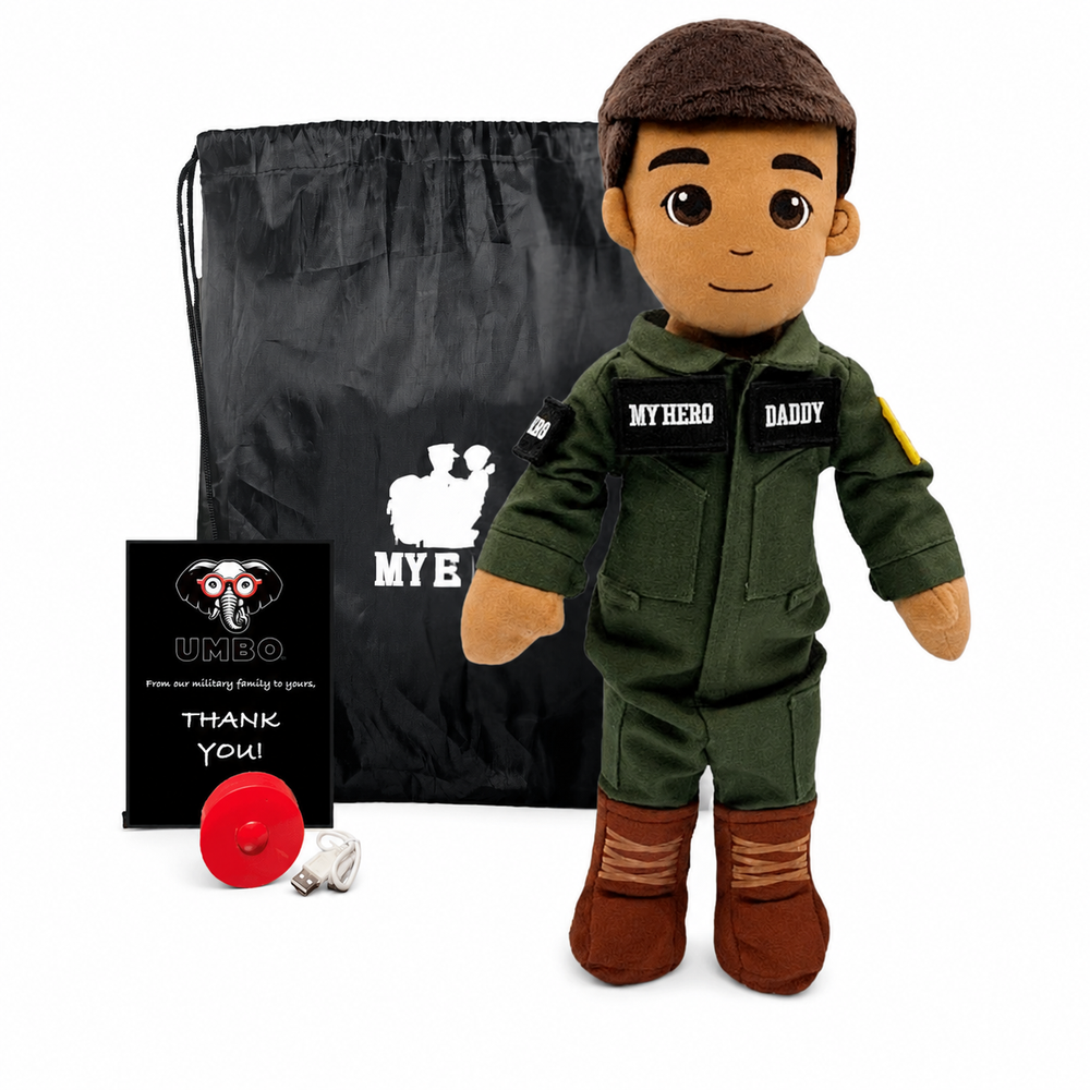 Pilot Doll Tan Skin Brown Hair Male Doll with Flight Suit, My Hero Backpack, Recorder and Charger A plush doll dressed in an olive green jumpsuit and brown cap, standing in front of a black drawstring bag, a small black card, and a red circular accessory on a white background.