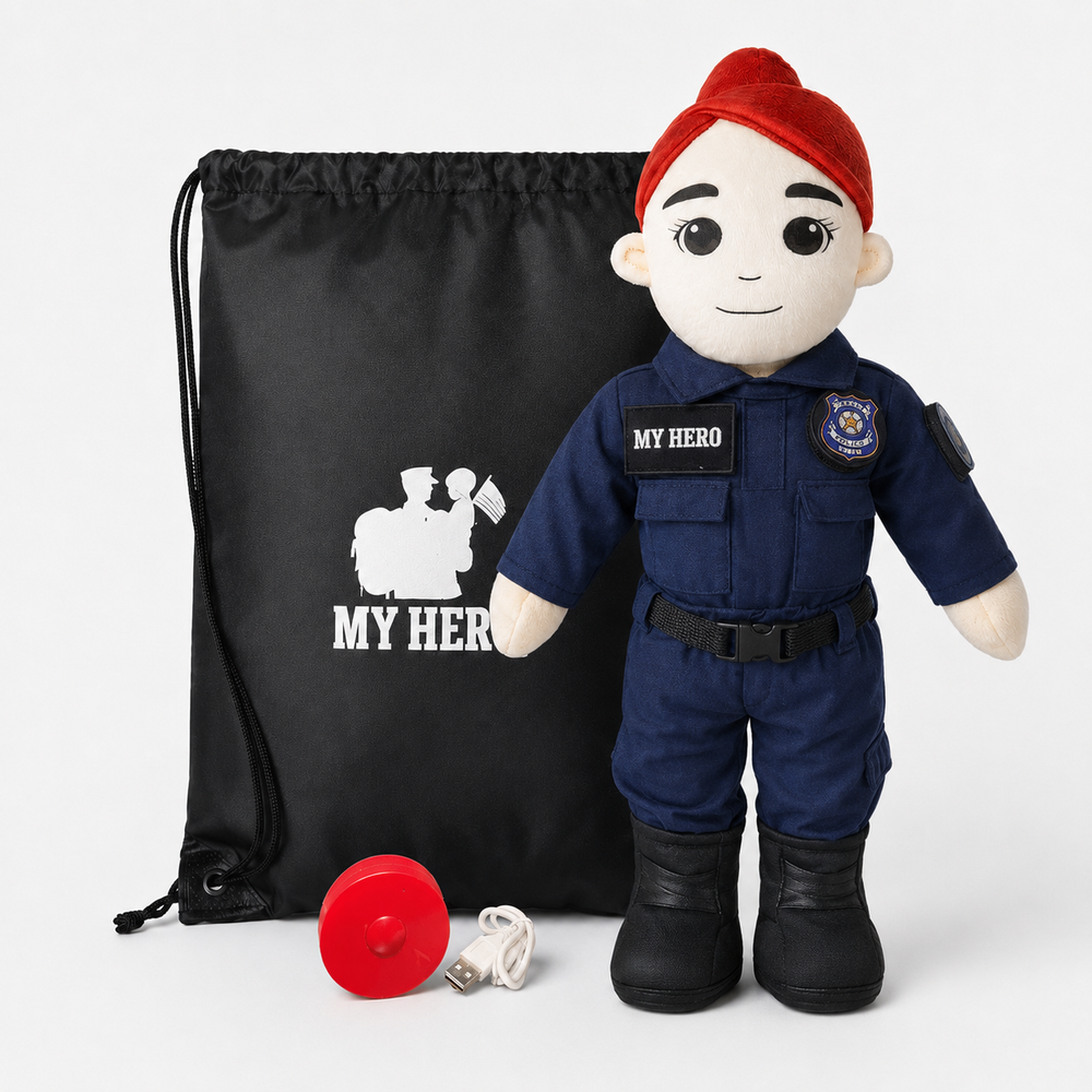 A plush toy dressed as a police officer stands next to a black drawstring bag with a white firefighter graphic and text, with a red helmet and white USB charging cable in front, on a light gray background.