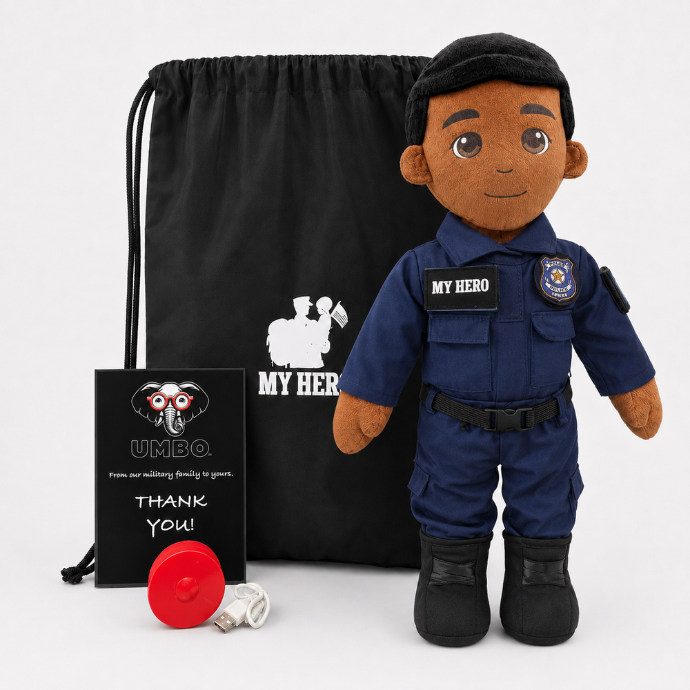 A plush police doll dressed in a navy blue police uniform with black boots and a black beret, standing in front of a black drawstring bag and a black card. The plush has a brown skin tone and dark brown hair.