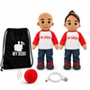 Two customizable plush toy dolls with realistic skin tones, wearing red and white raglan shirts with 'MY HERO' printed on the chest, blue jeans, and black shoes. The set includes a black drawstring bag with a white graphic, a red personal alarm, and a white USB charging cable, all on a white background.