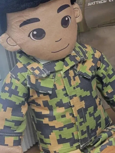 Plush toy in camouflage outfit with cartoonish design