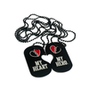 Pair of black dog tags with red broken-heart icons, reading 'MY HERO' and 'MY HEART' on bead chains.